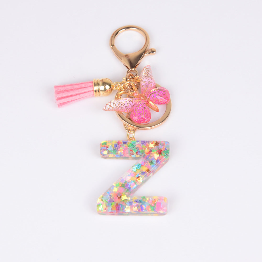 卸売スパンコール英語蝶タッセル文字樹脂キーホルダー