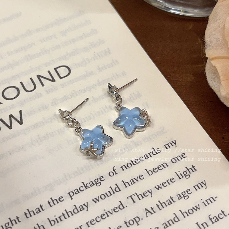 Pendientes de aleación de estrellas transparentes al por mayor