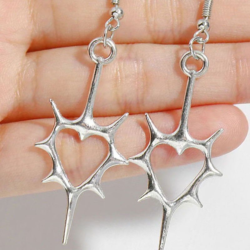 Wholesale Hollow pierced heart punk earrings