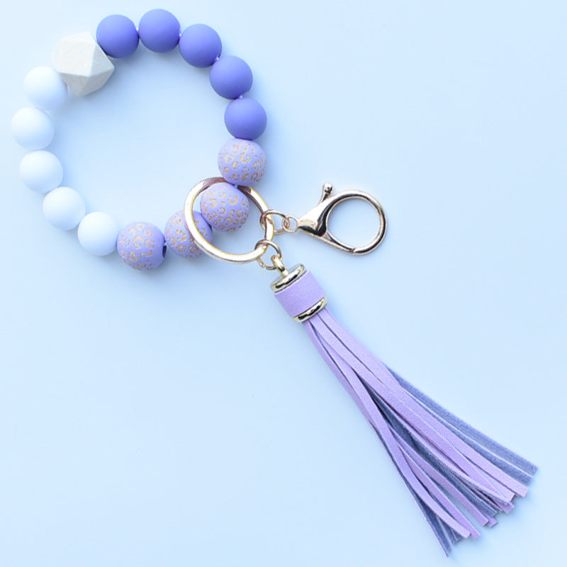 Wholesale Colorful leopard print silicone beaded bracelet keychain PU tassel pendant