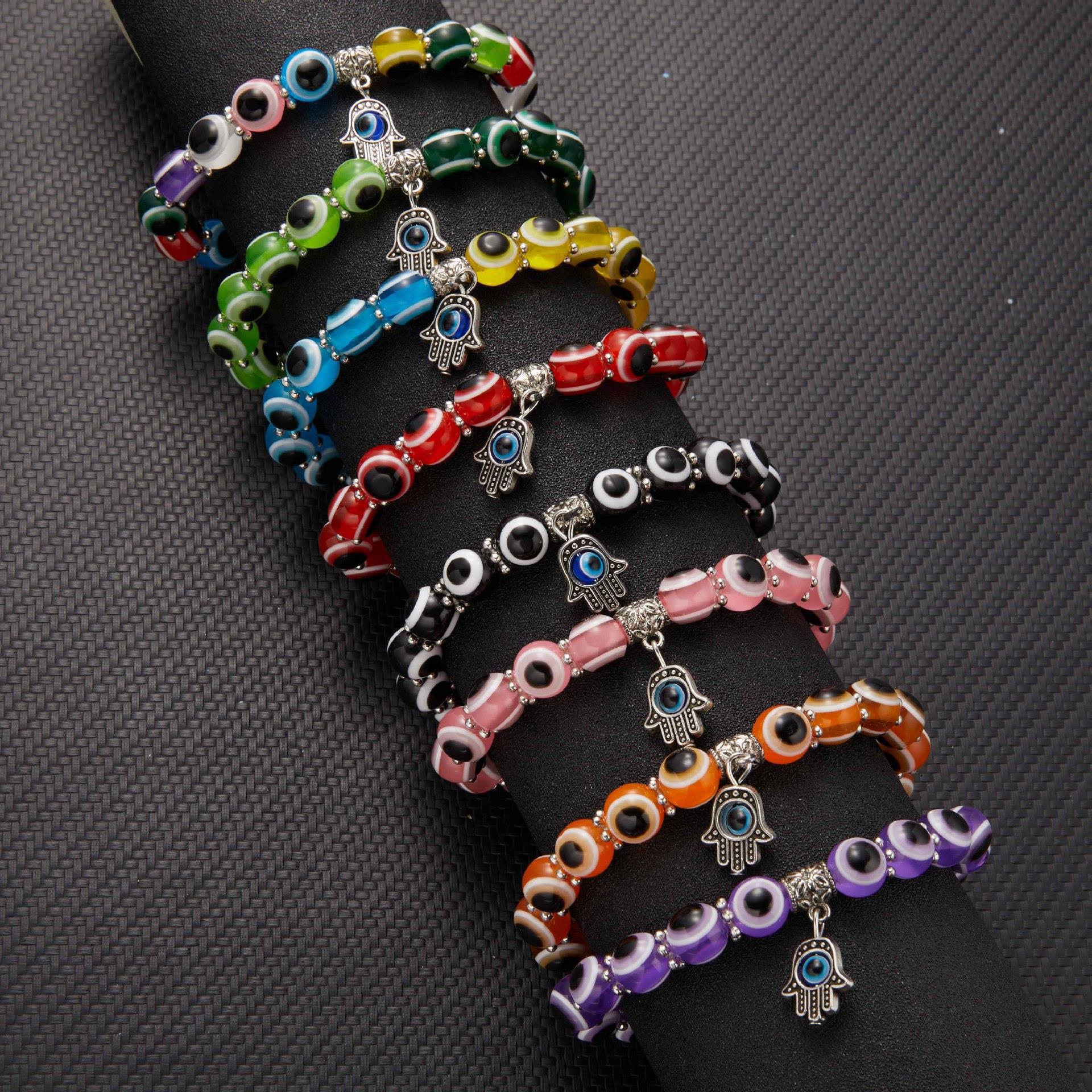Wholesale alloy palm hollow blue eyes beaded pendant elastic bracelet Charms