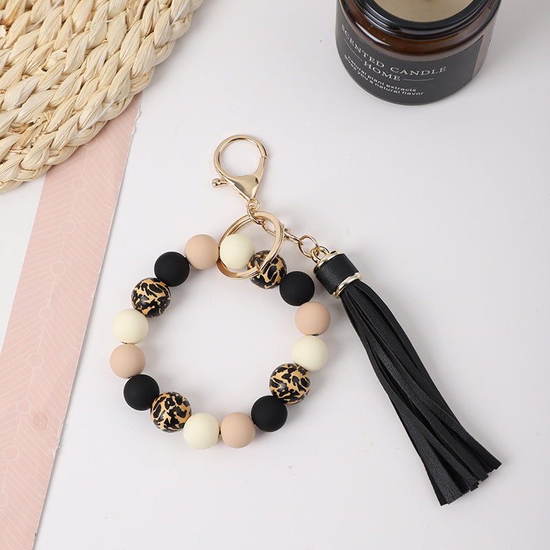 Llavero de muñeca de silicona de borla al por mayor