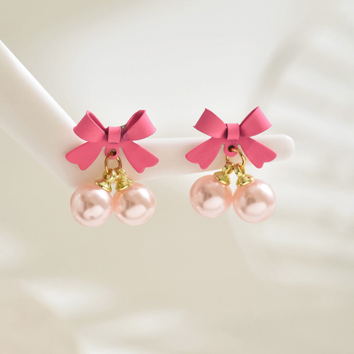 Wholesale Simple Bow Inlaid Pearl Earrings