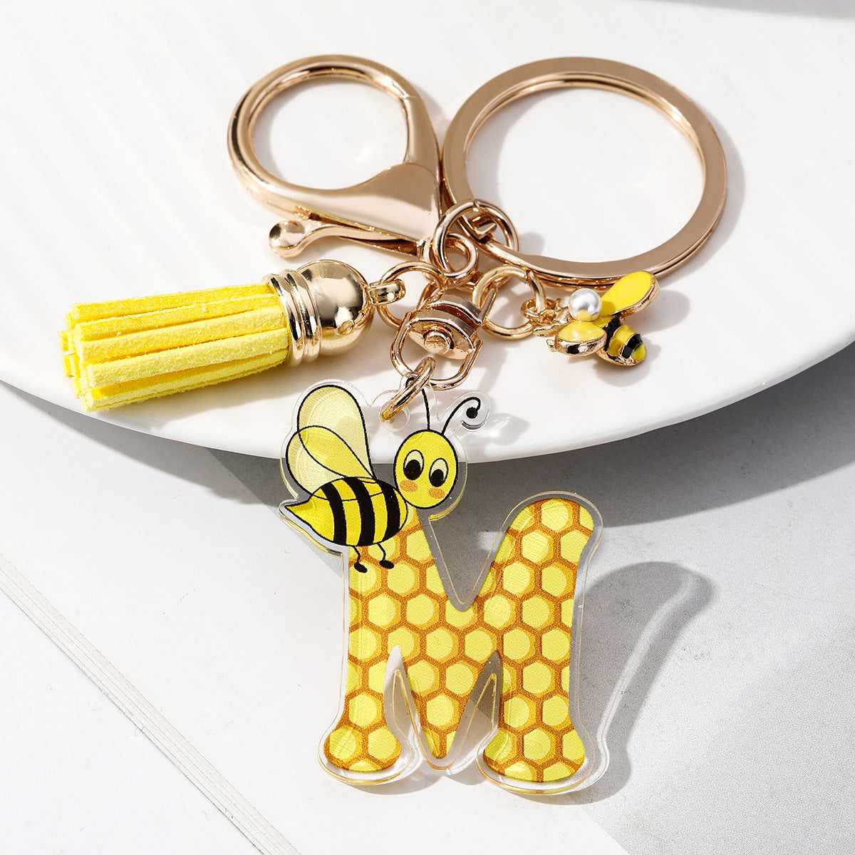 Wholesale Bee Honeycomb Acrylic English Letter Tassel Bee Enamel Keychain