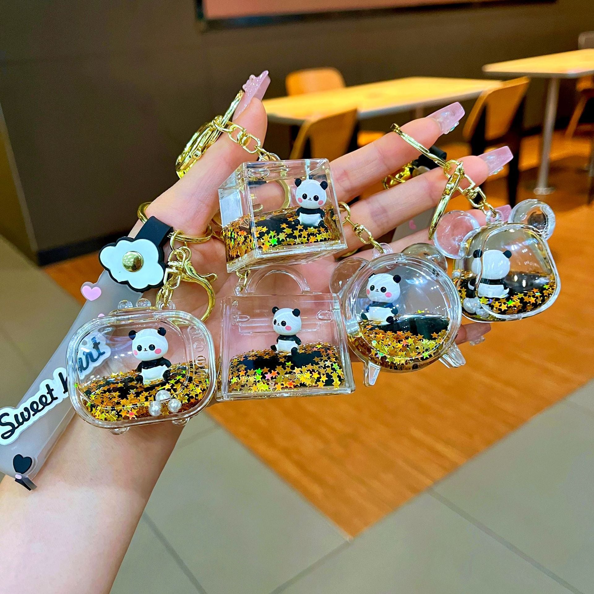 Wholesale Black gold floating cartoon cute panda Liquid Keychains