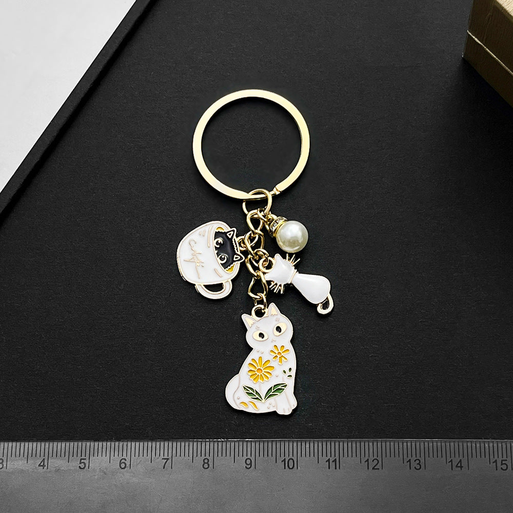 Wholesale Cartoon Oil Dropping Pearl Tea Cup White Cat Keychain Metal Alloy Bag Jewelry Pendant
