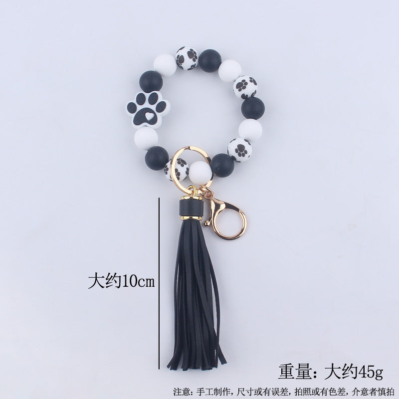 Wholesale Chic Silicone Bead Dog Paw Bracelet Keychain With Leather Tassel Fashion Gift For Resale