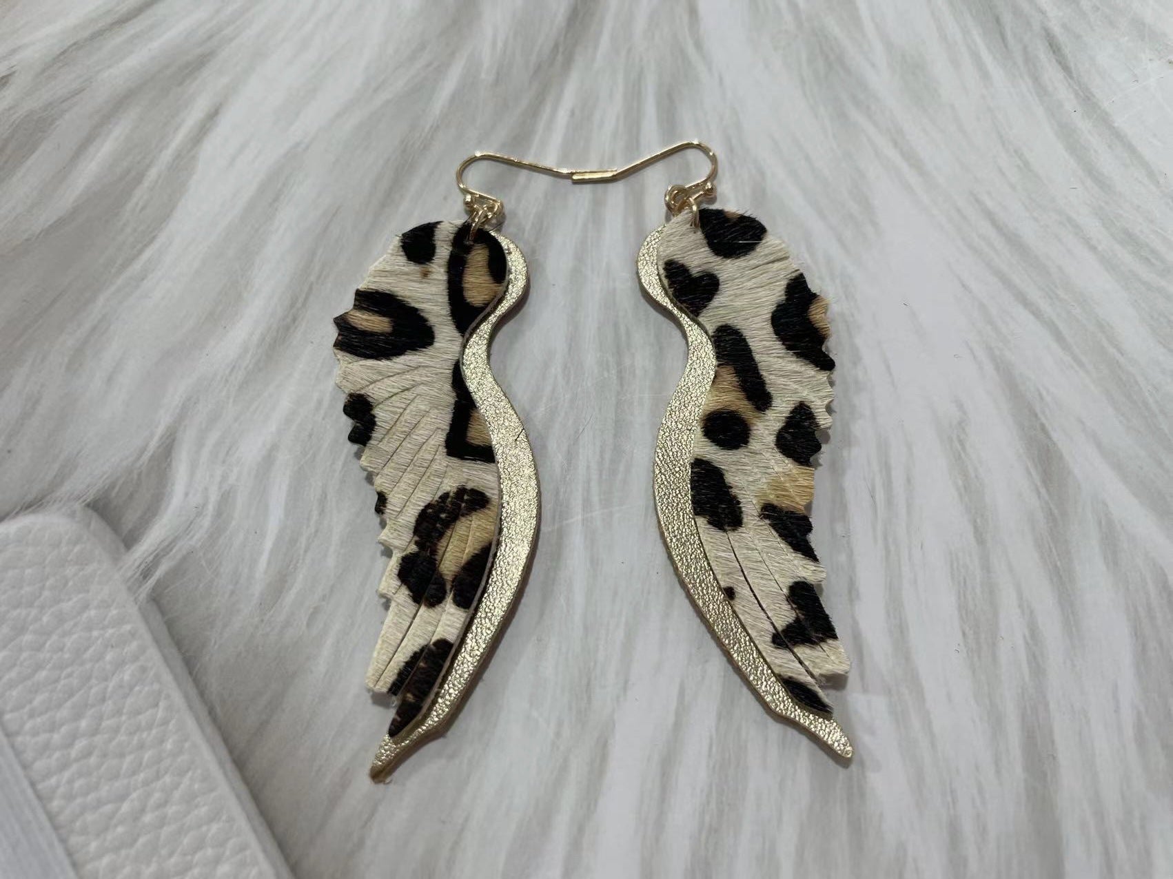 Pendientes de gorrión de plumas de cuero genuino genuinos al por mayor