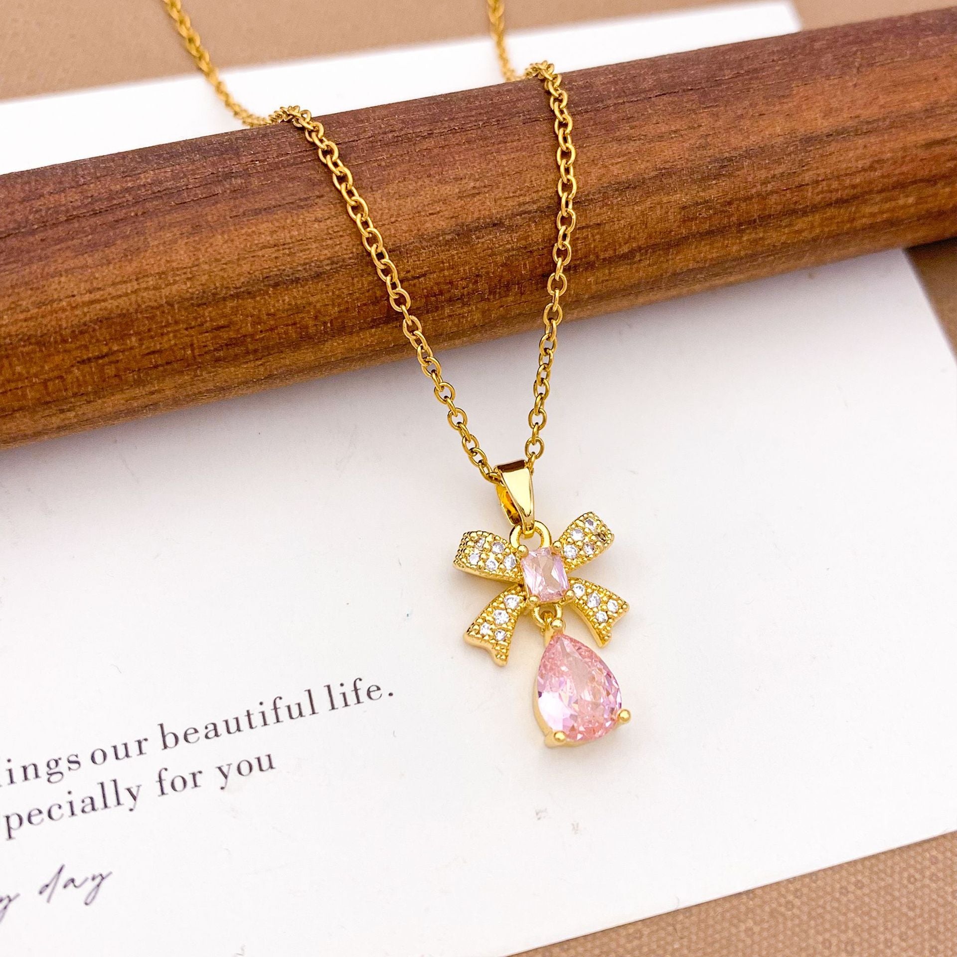 Wholesale Pink heart-shaped bow with diamond studded titanium steel necklace