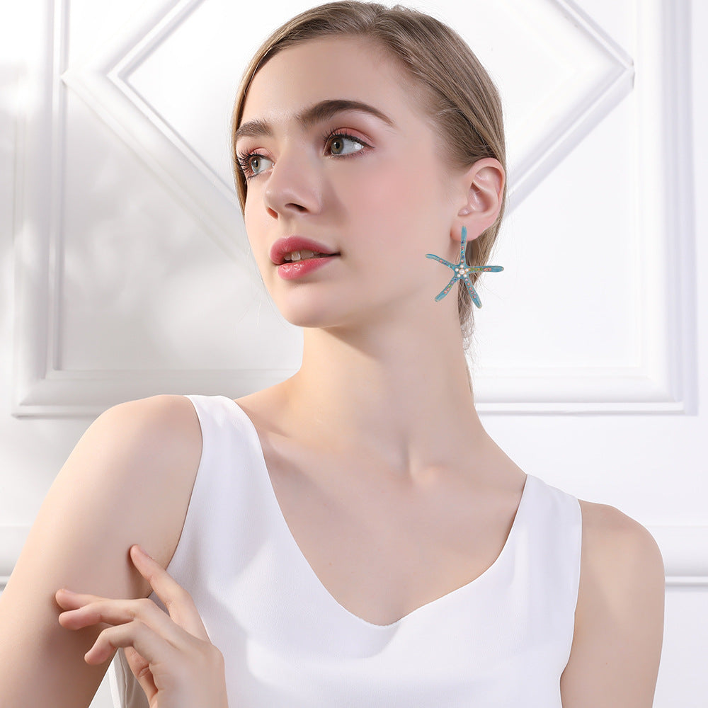 Pendientes al por mayor de aleación de perlas de estrellas de mar