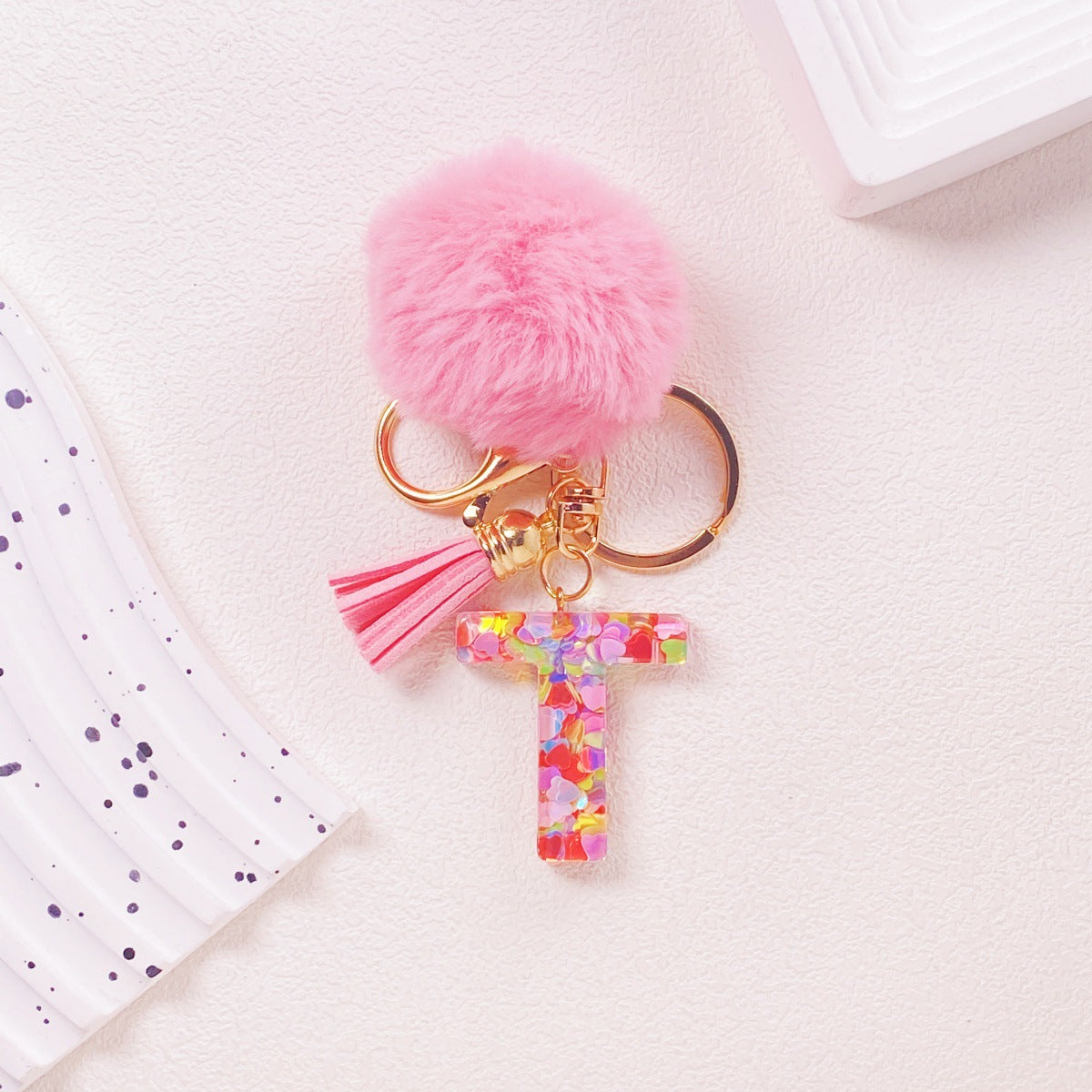 Wholesale Hairball English 26 letter pink Pom Pom keychain