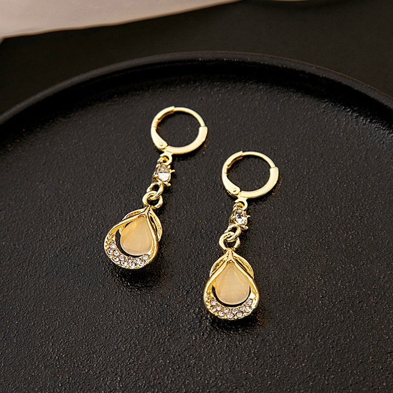 Wholesale Cat's Eye Stone Diamond Droplet Hollow Alloy Earrings