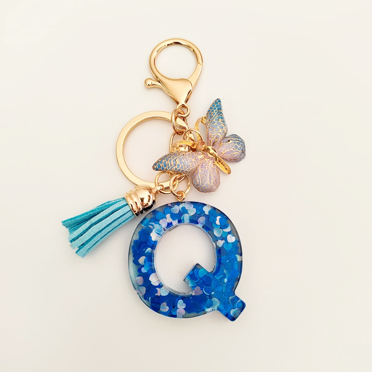 Wholesale blue crystal epoxy letter key chain pendant resin sequined butterfly key chain