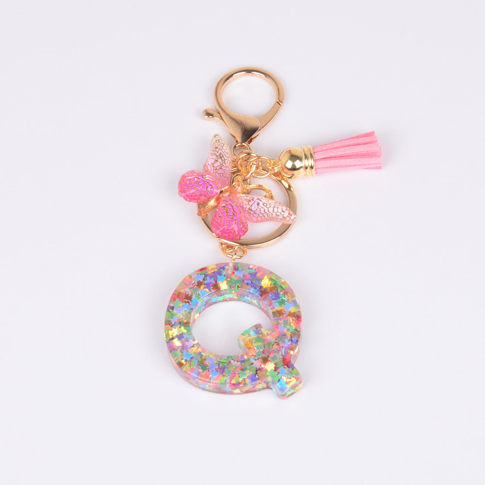 卸売スパンコール英語蝶タッセル文字樹脂キーホルダー