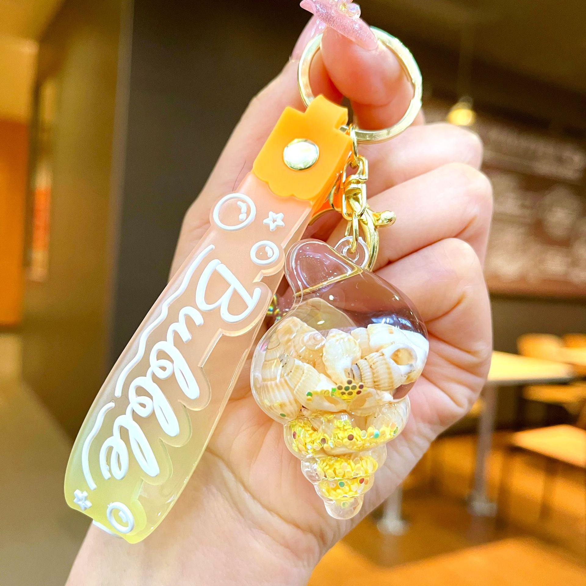 Wholesale Colorful flowing sand seashell DIY insert oil keychain