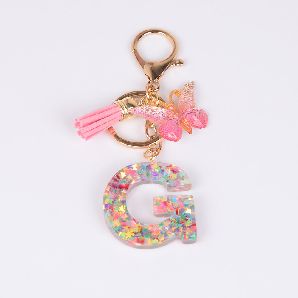 卸売スパンコール英語蝶タッセル文字樹脂キーホルダー