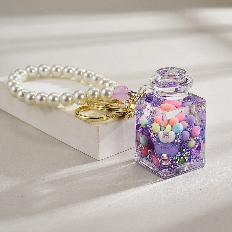 Wholesale Liquid sand bottle with colorful beads in oil bottle pendant acrylic keychain