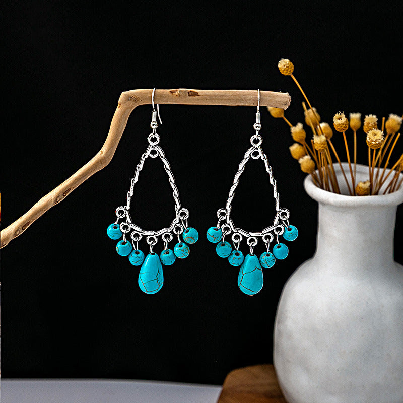Wholesale Hollow Circular Flower Tassel Alloy Earrings