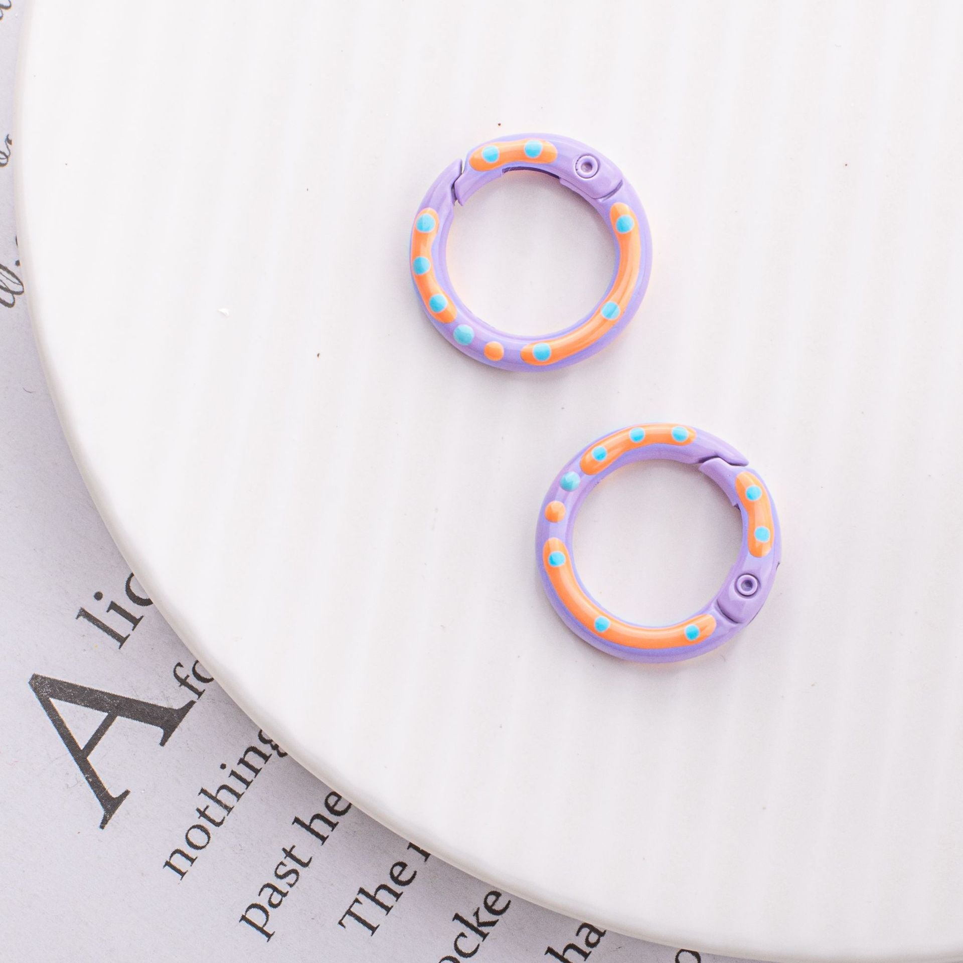 Wholesale Childlike Spring Buckle Double-sided Paint Hand-painted Colorful Polka Dot Round Alloy Keychain