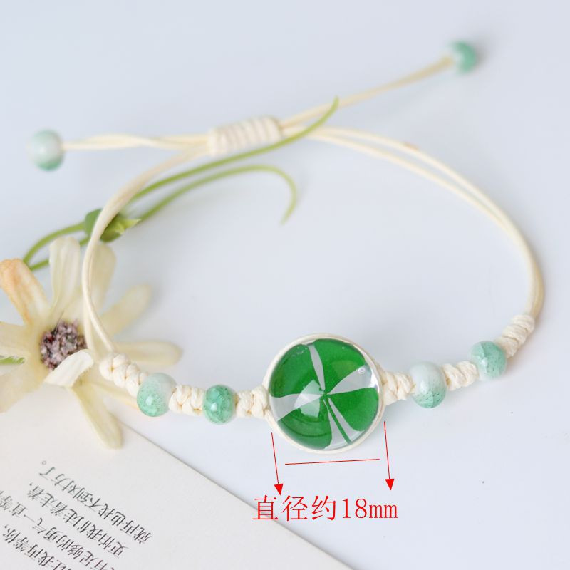 Pulsera tejida a mano de flores secas de cuatro hojas de cuatro hojas
