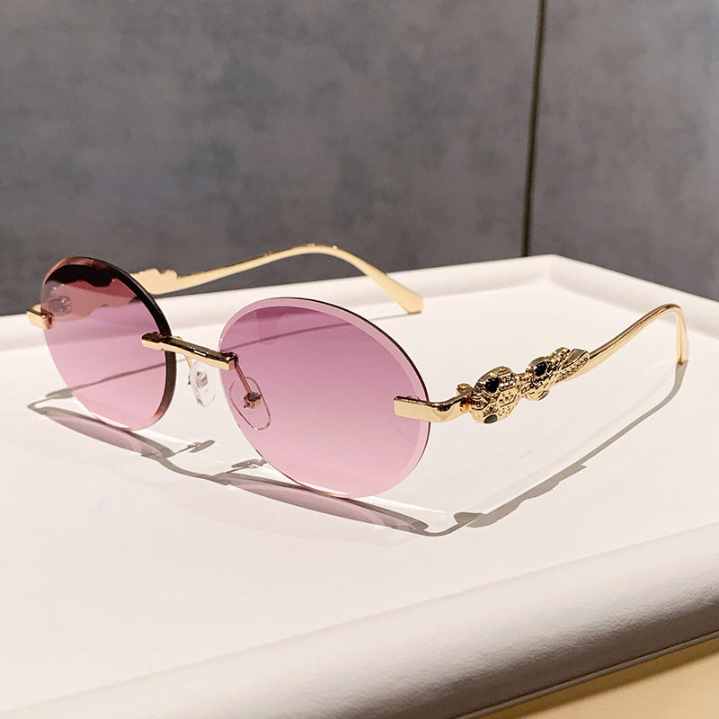 Wholesale Retro oval frameless sunshade sunglasses