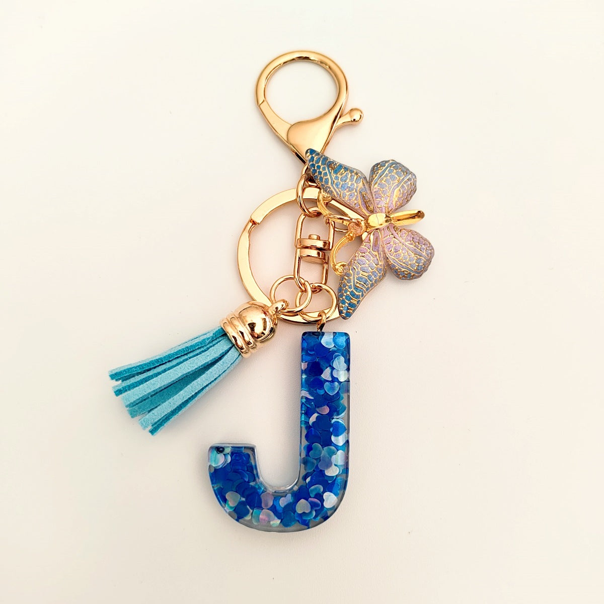 Wholesale blue crystal epoxy letter key chain pendant resin sequined butterfly key chain