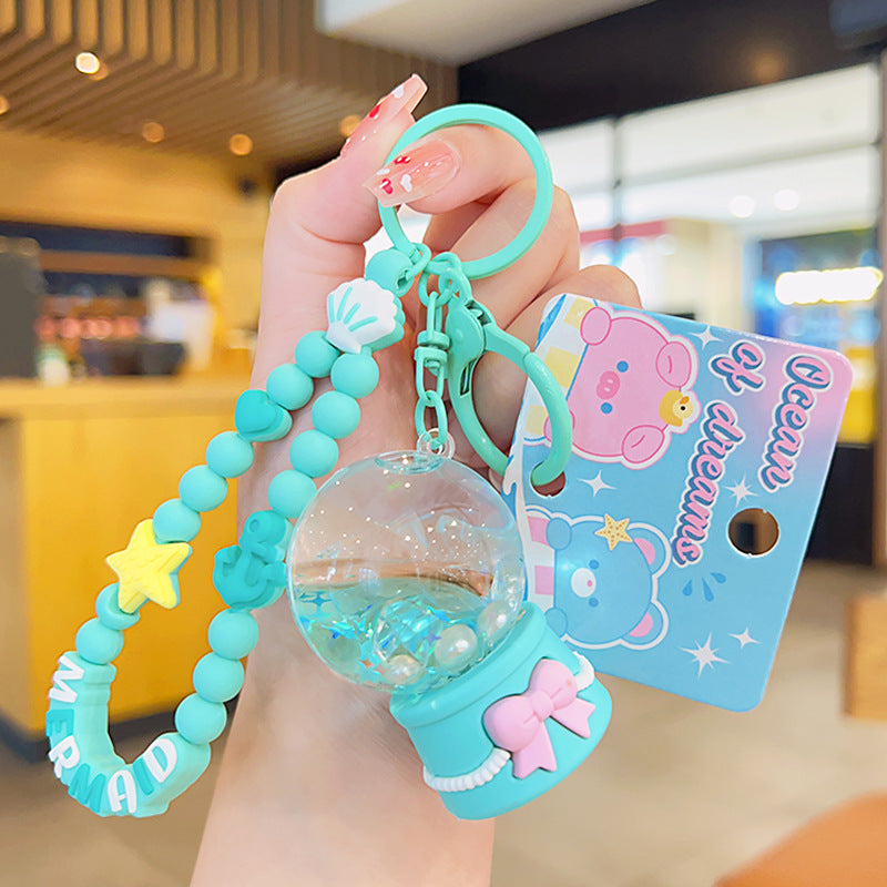 Cadena de llave acrílica de la bola de cristal del océano de sueño al por mayor