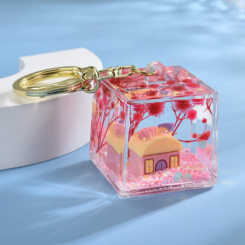 Wholesale Acrylic flowing sand in oil bottle keychain