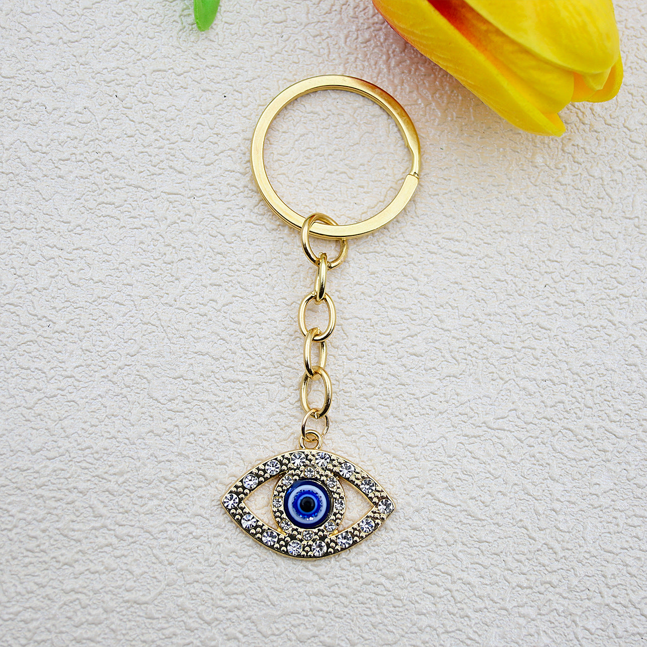 Wholesale Heart-shaped palm water droplet Devil' s eye keychain