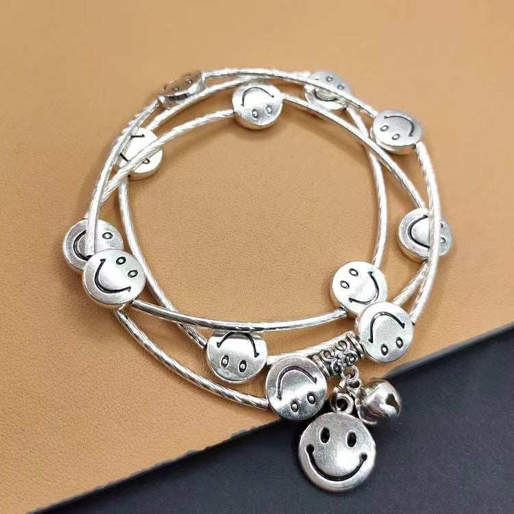 Wholesale Multi-Layered Triple Circle Bell Smiley Alloy Bracelet