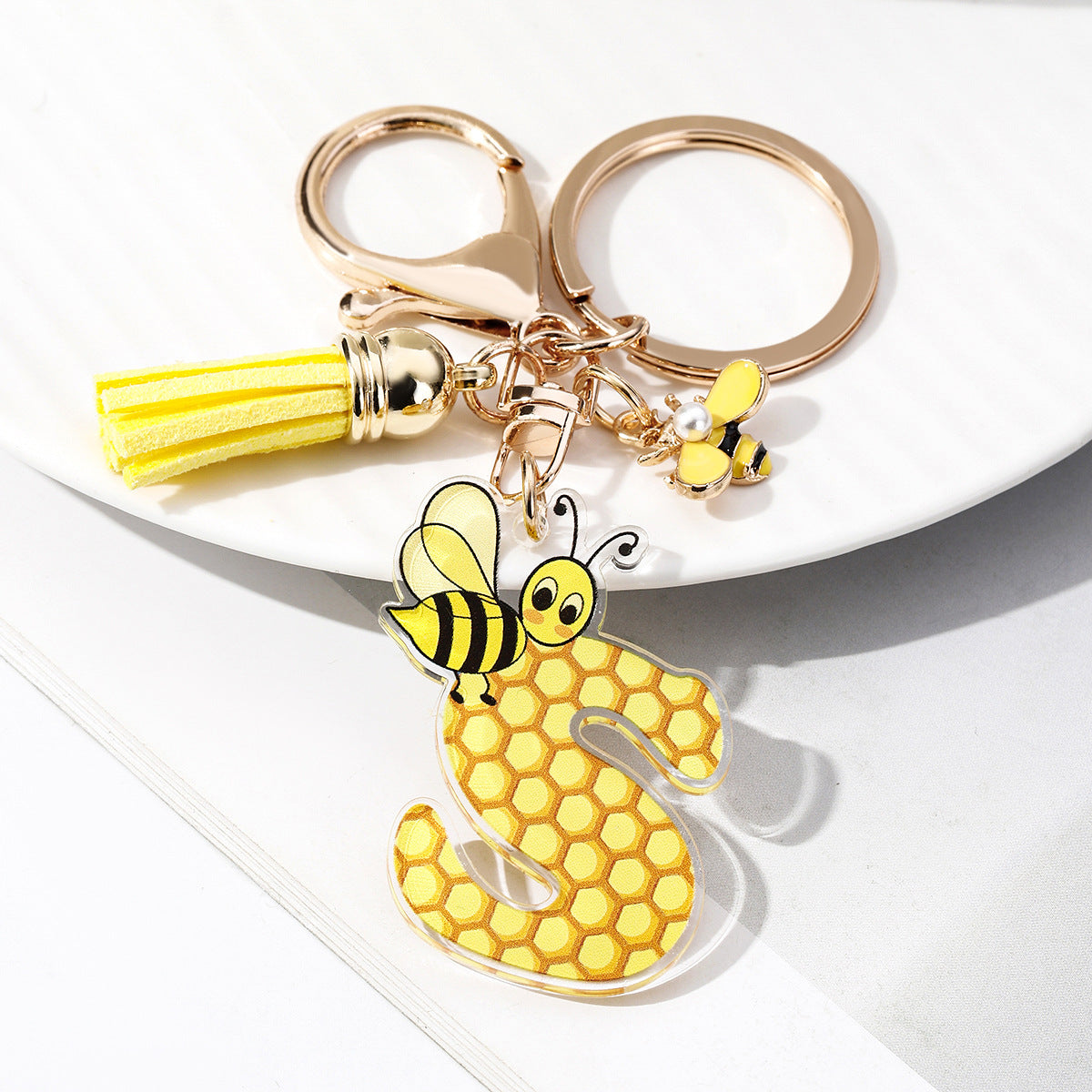 Wholesale Bee Honeycomb Acrylic English Letter Tassel Bee Enamel Keychain