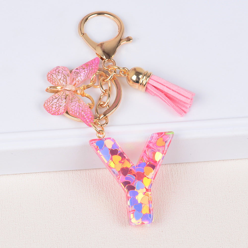 卸売ピンクタッセルバタフライグリッターレター樹脂キーホルダー