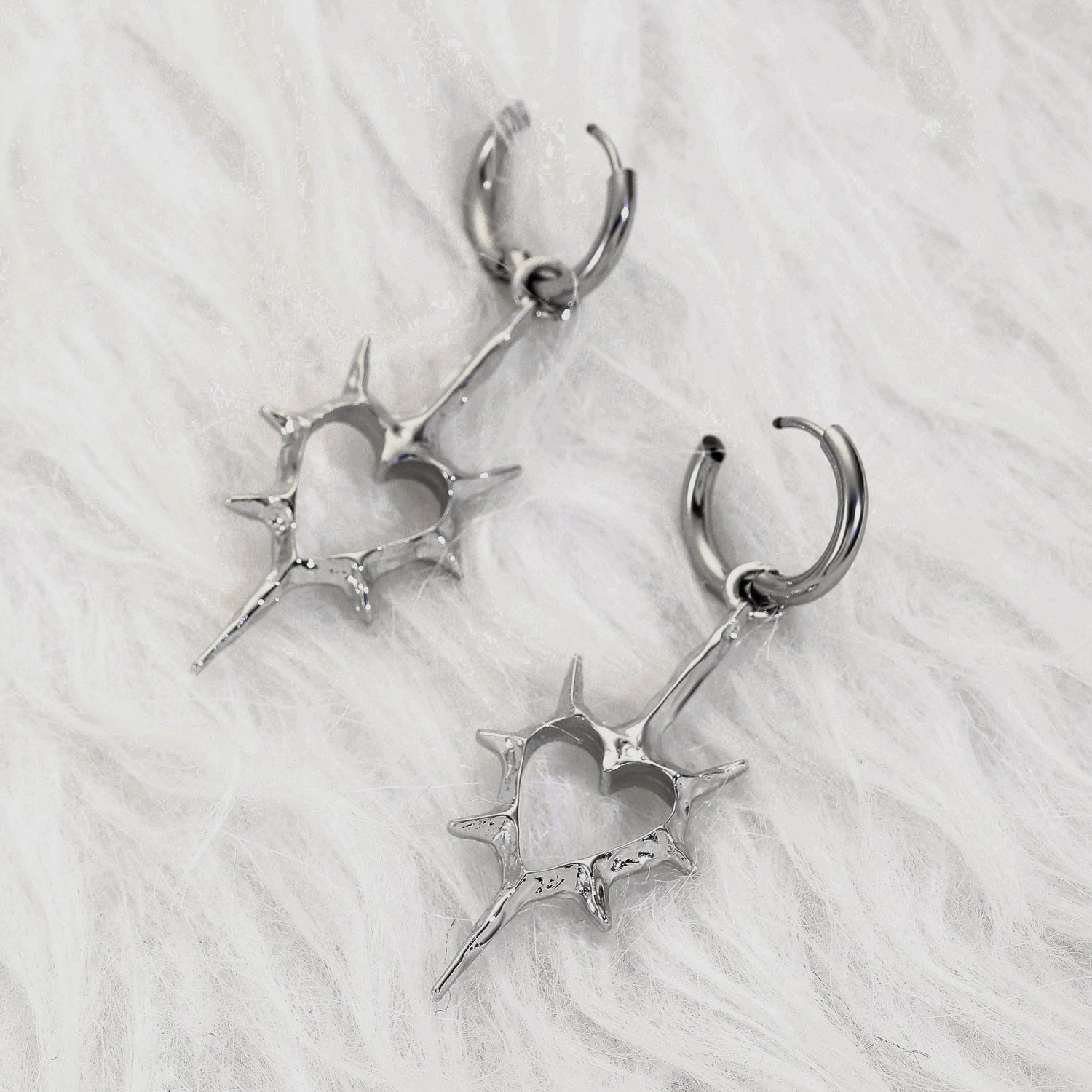 Wholesale Hollow thorn heart earrings