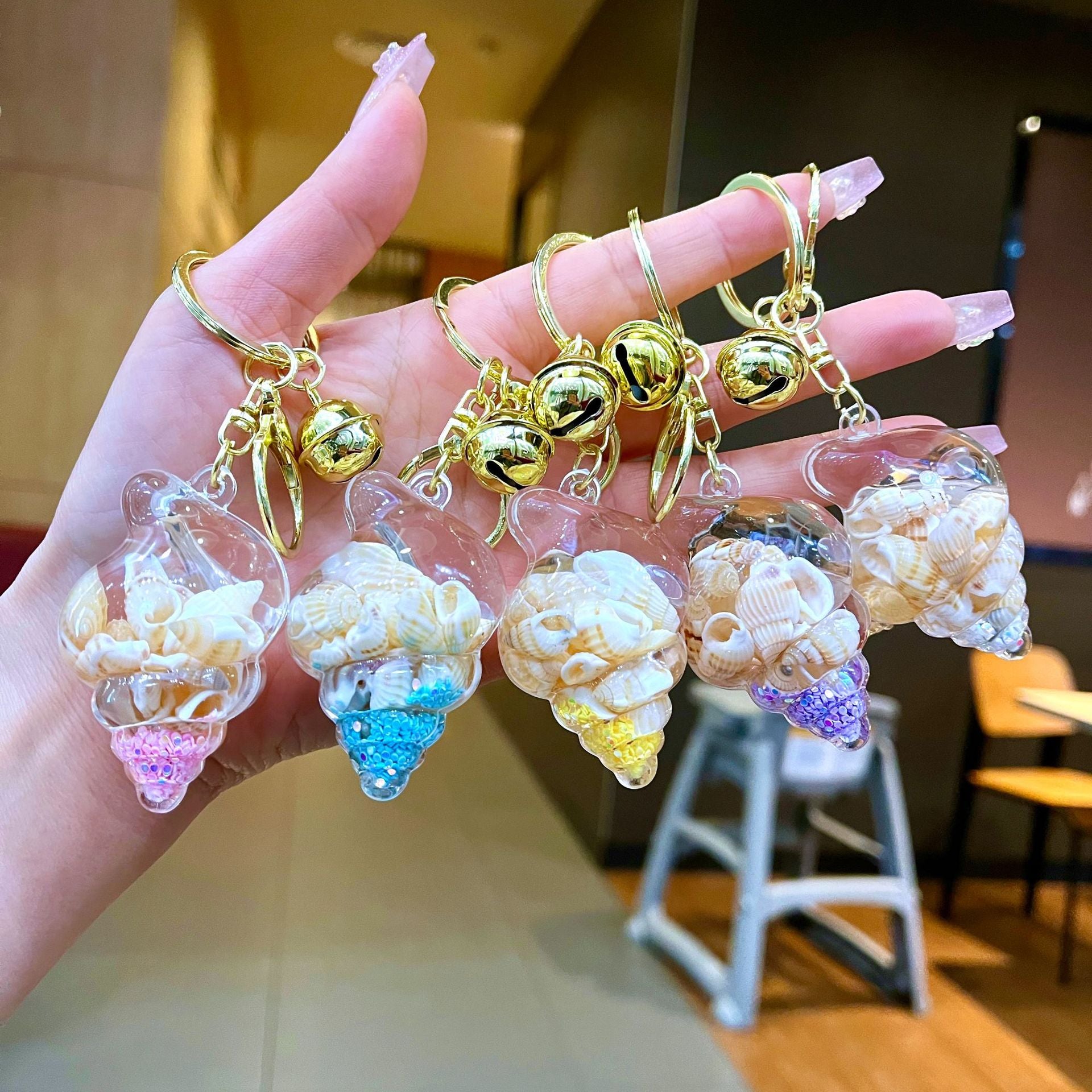 Wholesale Colorful flowing sand seashell DIY insert oil keychain