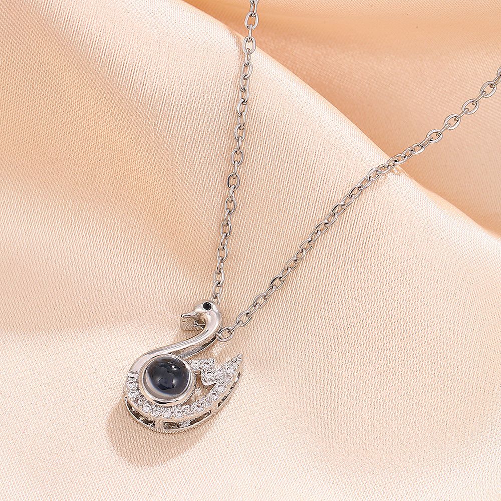 Wholesale Swan Cross Hundred Languages Projection Titanium Steel Necklace