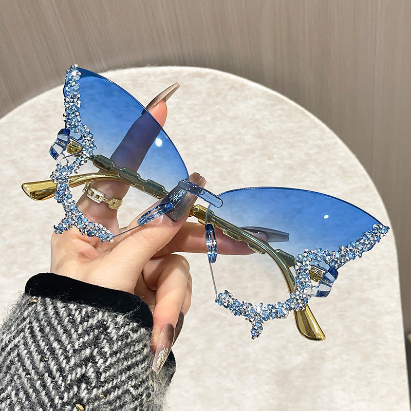 Wholesale Women's butterfly shape diamond frameless sunglasses