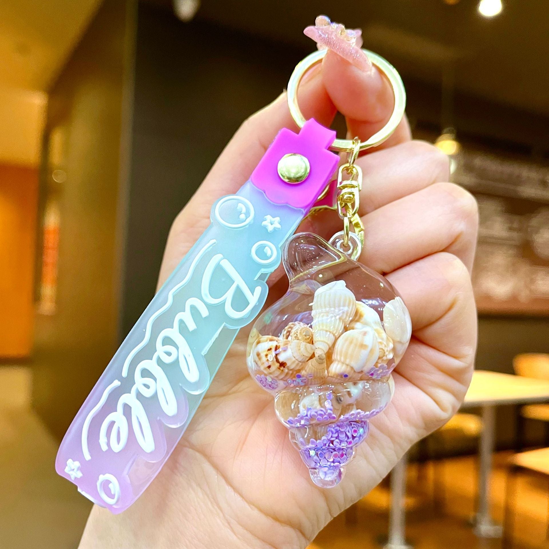 Wholesale Colorful flowing sand seashell DIY insert oil keychain