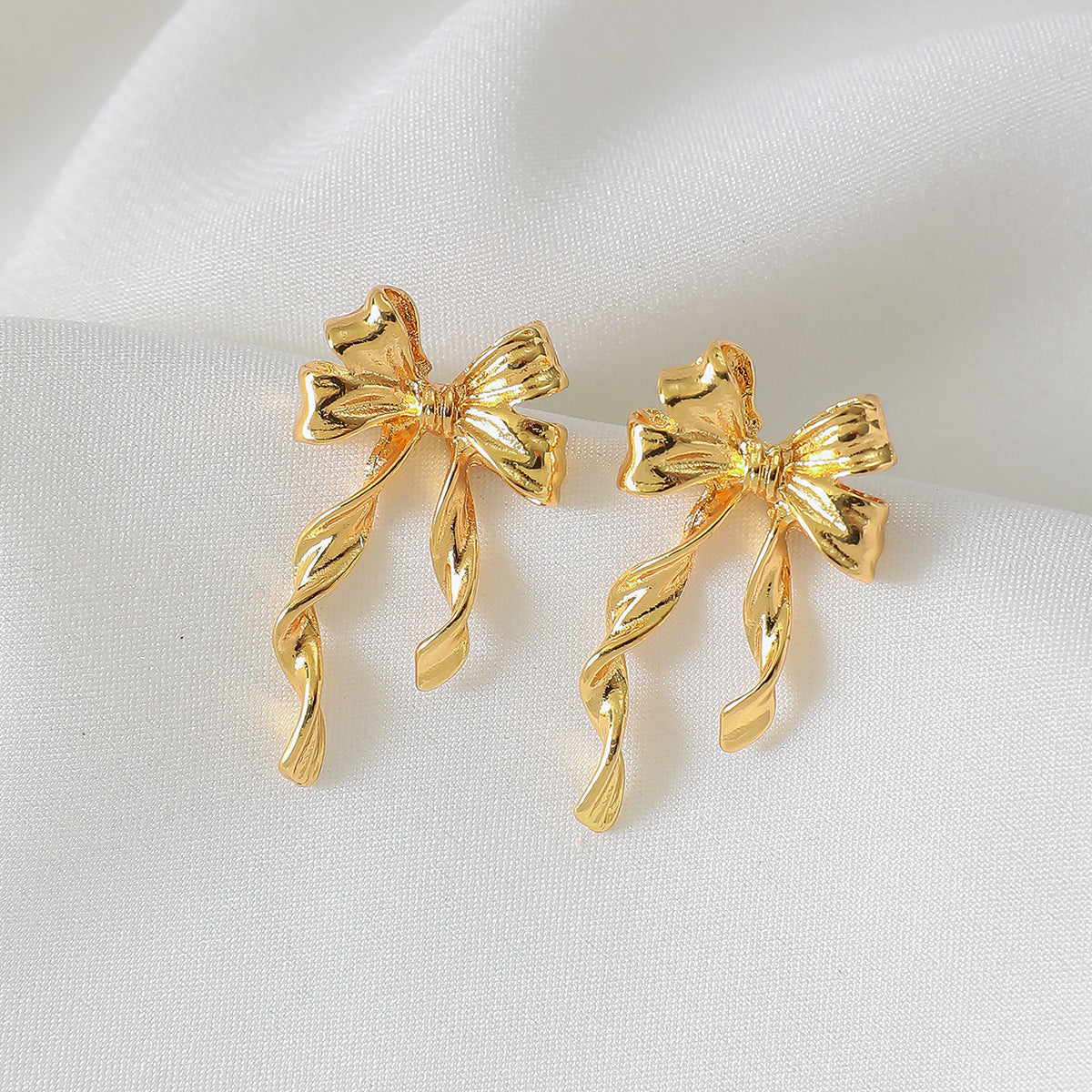 Wholesale Alloy gold bow earrings