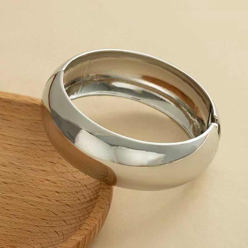 Wholesale Golden wide edged wave band exaggerated bracelet