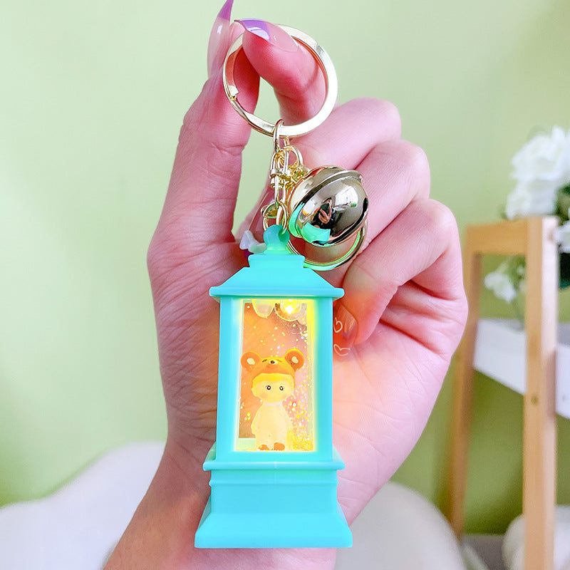 Llavero de faro acrílico al por mayor con luces y aceite para niñas