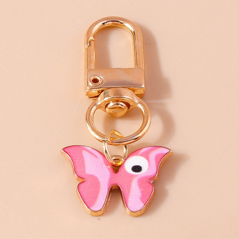 Wholesale Cartoon Butterfly Eyes Zinc Alloy Keychain