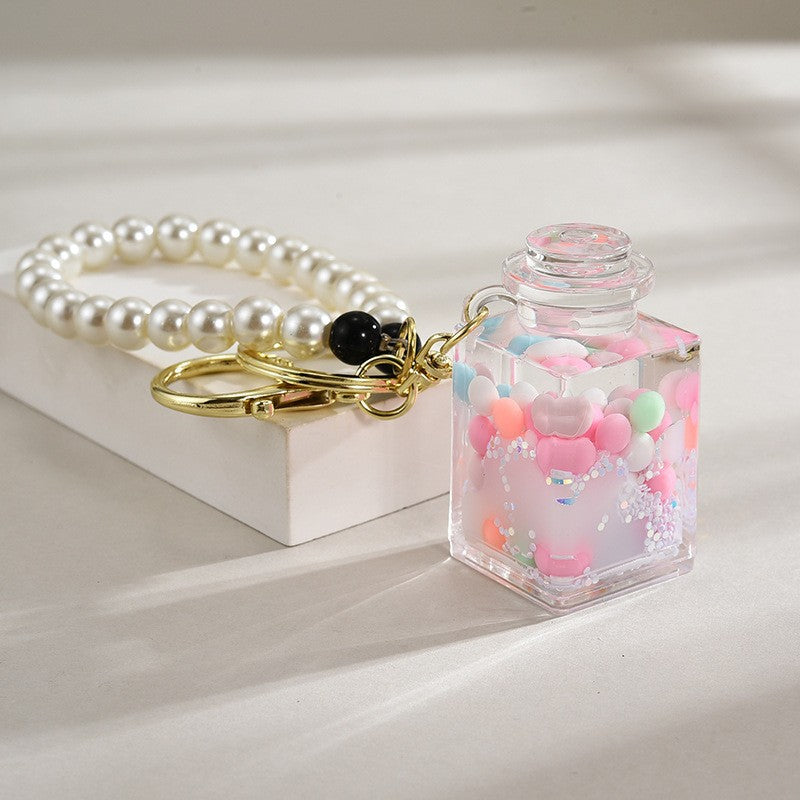 Wholesale Liquid sand bottle with colorful beads in oil bottle pendant acrylic keychain