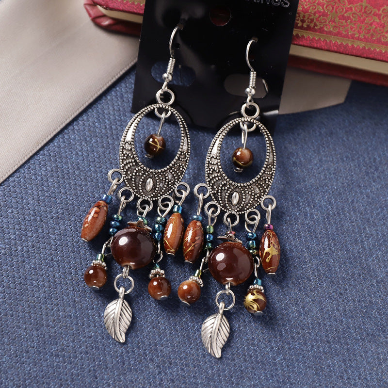 Wholesale Bohemian Retro Ethnic Style Ancient Silver Goddess Jewelry Face Skinny Tassel Long Earrings
