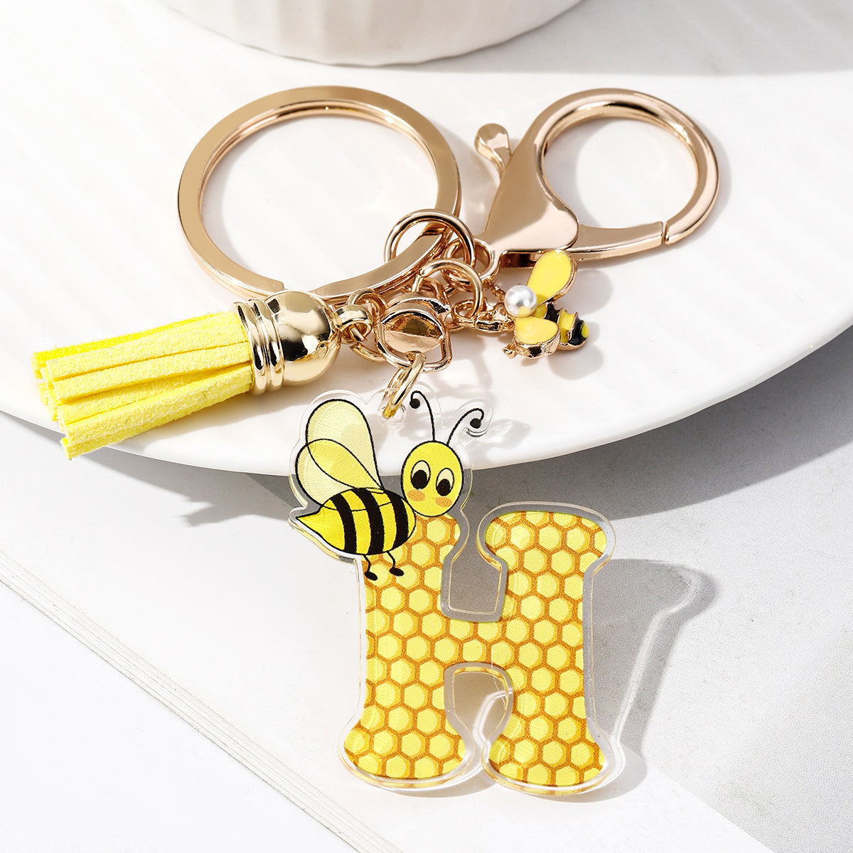 Wholesale Bee Honeycomb Acrylic English Letter Tassel Bee Enamel Keychain