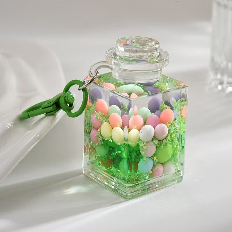 Wholesale Liquid sand bottle with colorful beads in oil bottle pendant acrylic keychain