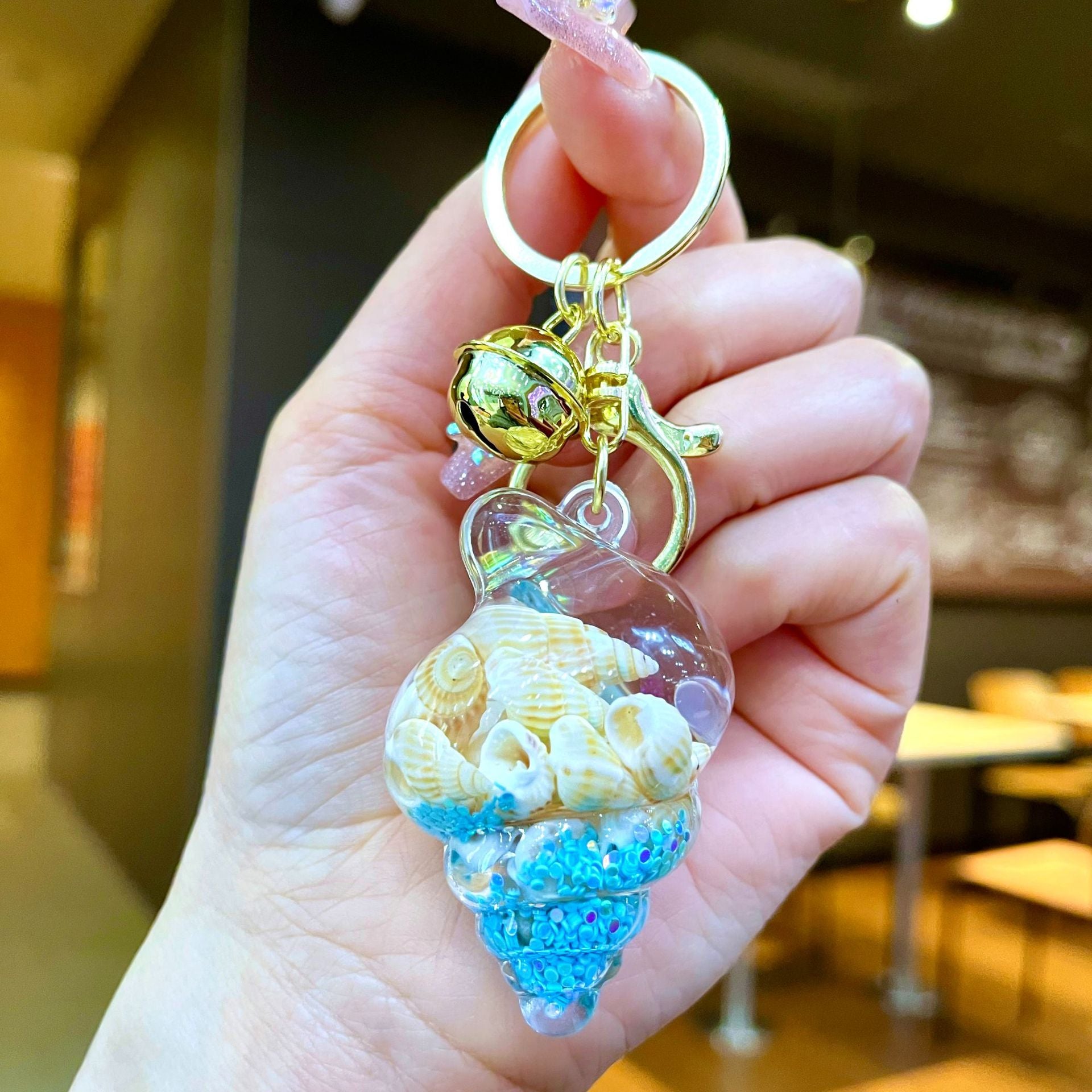 Wholesale Colorful flowing sand seashell DIY insert oil keychain
