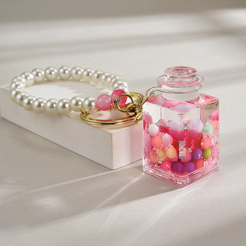 Wholesale Liquid sand bottle with colorful beads in oil bottle pendant acrylic keychain