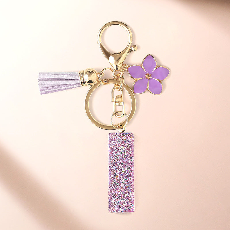 Wholesale Sparkling Pink 26 English Letter Purple Flower Keychain
