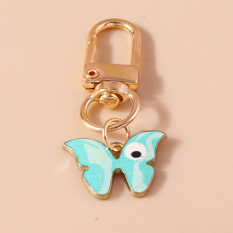 Wholesale Cartoon Butterfly Eyes Zinc Alloy Keychain