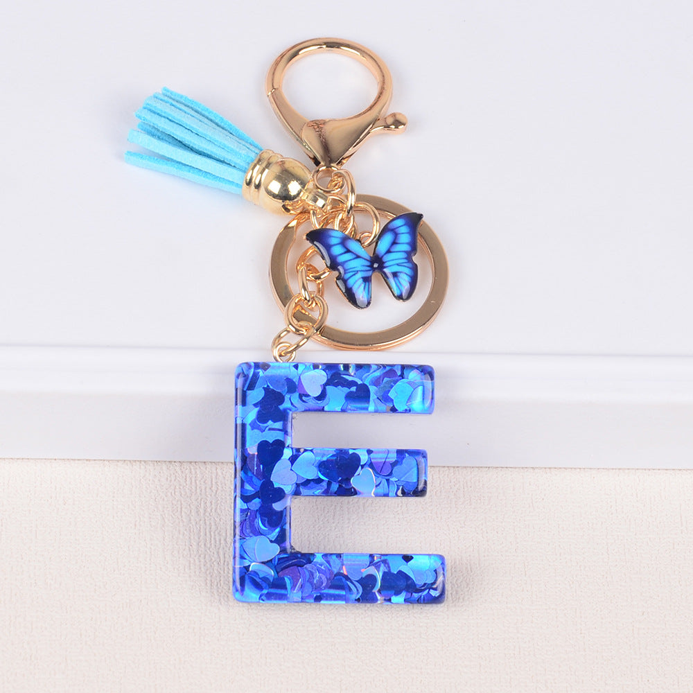 卸売ブルーラブバタフライタッセルレター樹脂キーホルダー